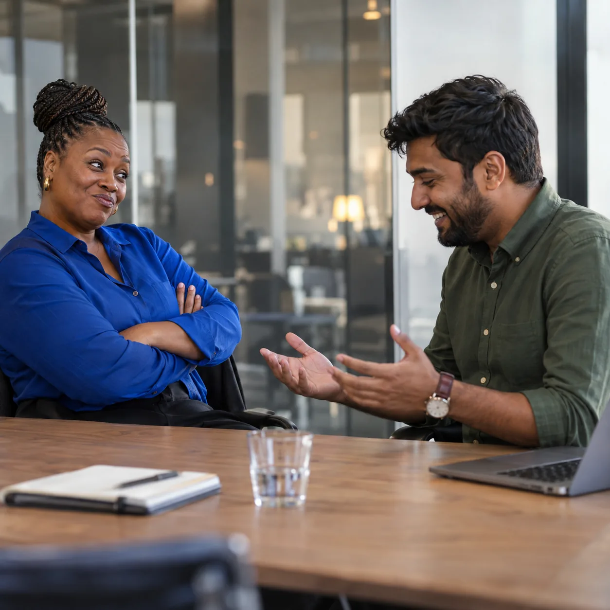 Two colleagues role-play a sales call, one playing a sceptical buyer